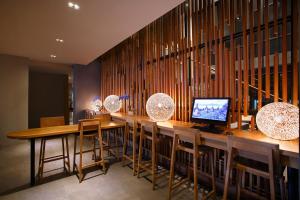 BATIQA Hotel Jababeka Cikarangにあるテレビまたはエンターテインメントセンター