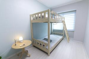 Postel nebo postele na pokoji v ubytování Cobe Guesthouse Dongdaemun