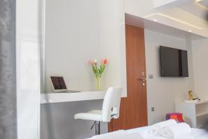 TV a/nebo společenská místnost v ubytování Studio Apartment Lena