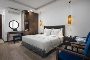 Postel nebo postele na pokoji v ubytování Bonsella Hotel