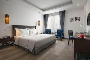 Postel nebo postele na pokoji v ubytování Bonsella Hotel