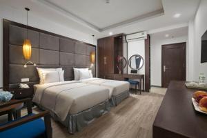 Postel nebo postele na pokoji v ubytování Bonsella Hotel