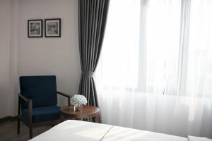 Postel nebo postele na pokoji v ubytování Bonsella Hotel