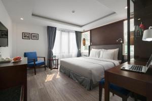 Postel nebo postele na pokoji v ubytování Bonsella Hotel