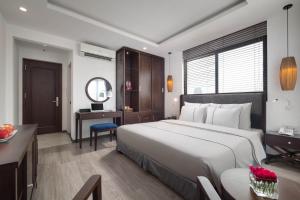 Postel nebo postele na pokoji v ubytování Bonsella Hotel