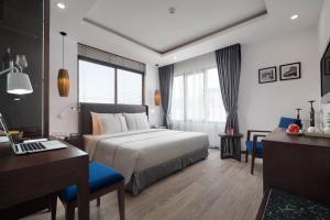 Postel nebo postele na pokoji v ubytování Bonsella Hotel