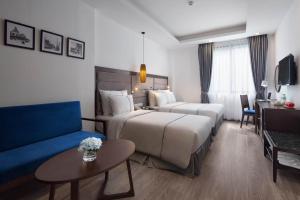 Postel nebo postele na pokoji v ubytování Bonsella Hotel