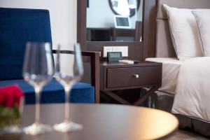 Postel nebo postele na pokoji v ubytování Bonsella Hotel