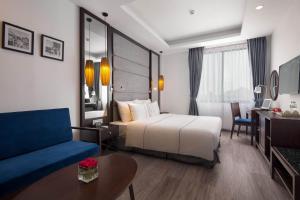 Postel nebo postele na pokoji v ubytování Bonsella Hotel