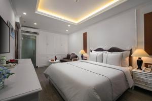 Postel nebo postele na pokoji v ubytování Bonsella Hotel