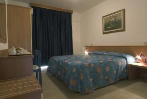 Postel nebo postele na pokoji v ubytování Hotel Santa Cruz