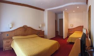 Postel nebo postele na pokoji v ubytování Ariston Lake View Hotel