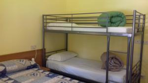 Voodi või voodid majutusasutuse Albergo Caprile toas