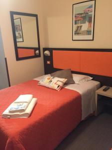 Postel nebo postele na pokoji v ubytování Hotel Belvedere Spiaggia