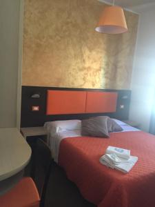 Postel nebo postele na pokoji v ubytování Hotel Belvedere Spiaggia