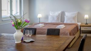 Postel nebo postele na pokoji v ubytování Penzion Apartmány Hradební