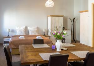 Postel nebo postele na pokoji v ubytování Penzion Apartmány Hradební