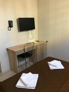 TV a/nebo společenská místnost v ubytování Galian Hotel