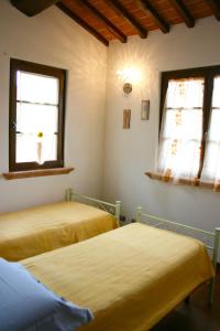 Ένα ή περισσότερα κρεβάτια σε δωμάτιο στο Casa Rolu