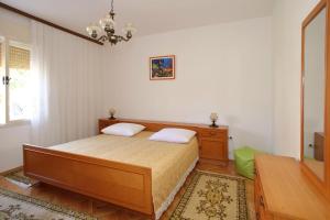 Postel nebo postele na pokoji v ubytování Apartment Josip