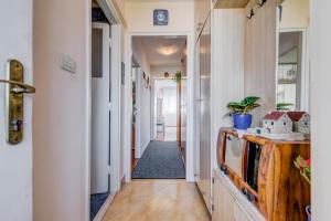 a hallway of a home with a house on a tv at Rooms Alijev in Split