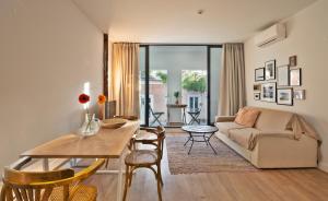a living room with a table and a couch at The Salty Lodge in Lagos