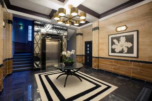 a lobby with a table and a hallway at No.8 Waterloo Street in Birmingham