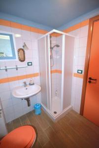 a bathroom with a shower and a sink at Palazzo Jannoni Holiday in SantʼAndrea Apostolo dello Ionio