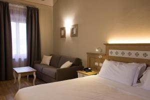 Letto o letti in una camera di Hotel Sesmones