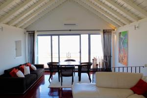a living room with a couch and a table at Villa St Roko - Charme Holidays in Sutivan