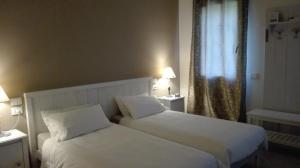 Postel nebo postele na pokoji v ubytování B&B Borgo Arcadia