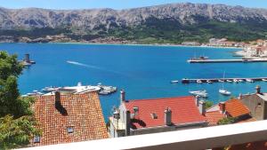 a view of a harbor with boats in the water at Apartments Andrea in Baška