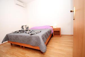 Postel nebo postele na pokoji v ubytování Apartments Katarina
