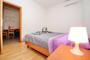 Postel nebo postele na pokoji v ubytování Apartments Katarina