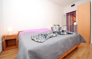 Postel nebo postele na pokoji v ubytování Apartments Katarina