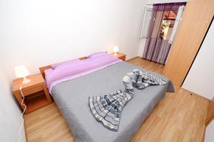 Postel nebo postele na pokoji v ubytování Apartments Katarina