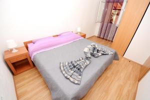 Postel nebo postele na pokoji v ubytování Apartments Katarina