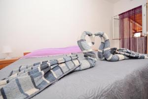Postel nebo postele na pokoji v ubytování Apartments Katarina