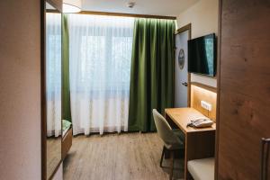 TV a/nebo společenská místnost v ubytování Gasthof-Pension Luger