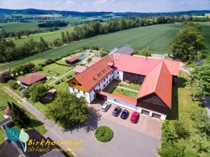 an aerial view of a house with a red roof at Birkholmhof in Bärnau