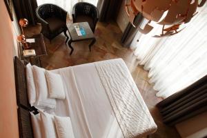 Кровать или кровати в номере Olivi Hotel & Natural Spa