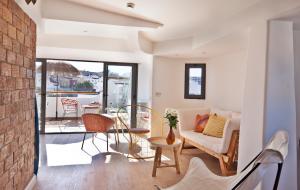 a living room with a couch and a table at The Salty Lodge in Lagos