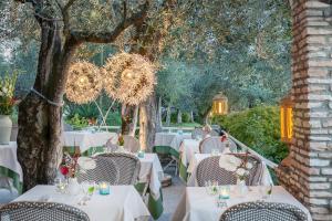 Сад в Olivi Hotel & Natural Spa