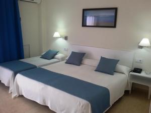 Postel nebo postele na pokoji v ubytování Hotel Sicania