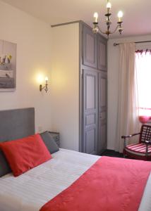 Postel nebo postele na pokoji v ubytování Hotel Les Acacias