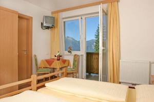 Postel nebo postele na pokoji v ubytování Jugend- und Familienhotel Venedigerhof + 37 fotografií