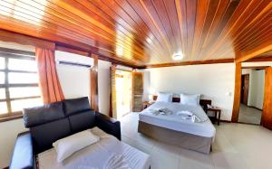 Katil atau katil-katil dalam bilik di Makaira Beach Resort +241 gambar