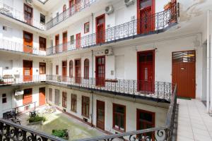 an overhead view of a building with red doors and balconies at Buda Castle Apartment in Budapest