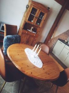 a wooden table in a living room with a tableablish at Biohof Zahn in Hockenheim