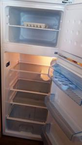 an open refrigerator with its door open at La Canardiere in Casta